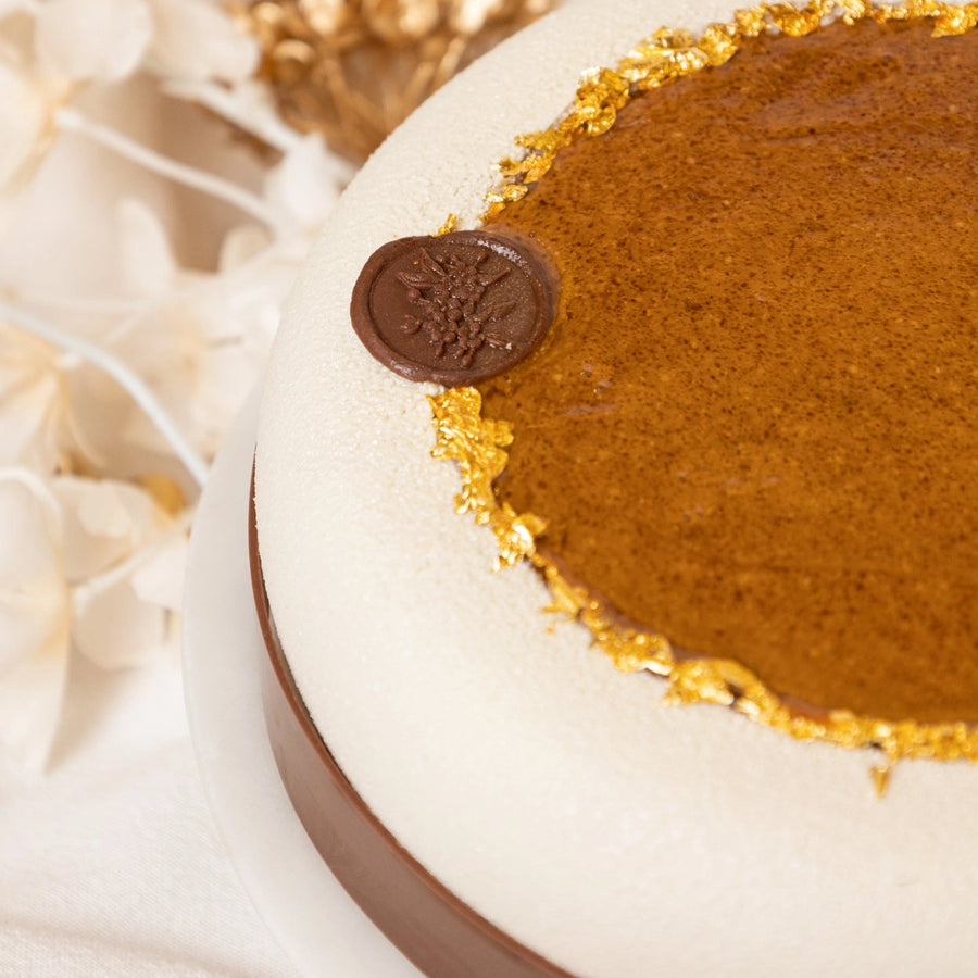 Close-up of a dessert with a chocolate topping on a white background